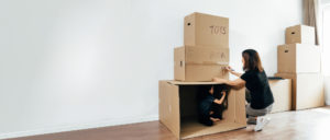 Mother and child packing boxes, Storage solutions at Guardian Essendon