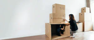 Mother and child packing boxes, Storage solutions at Guardian Essendon